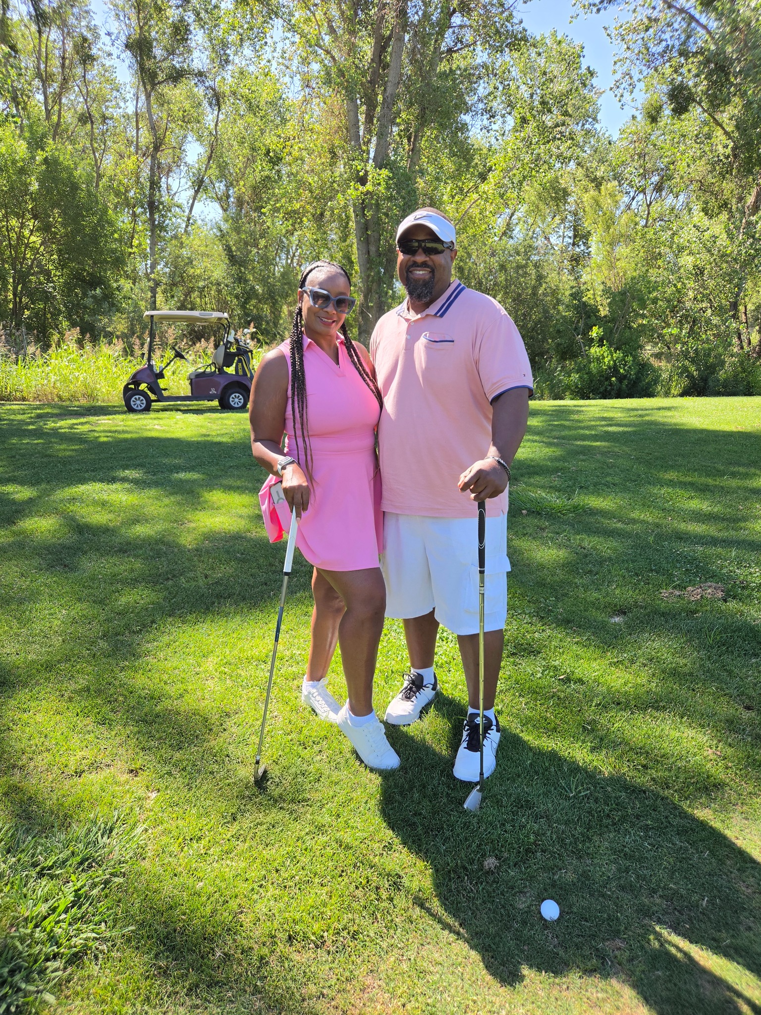 Kwame Fields with a colleague at a community golf event