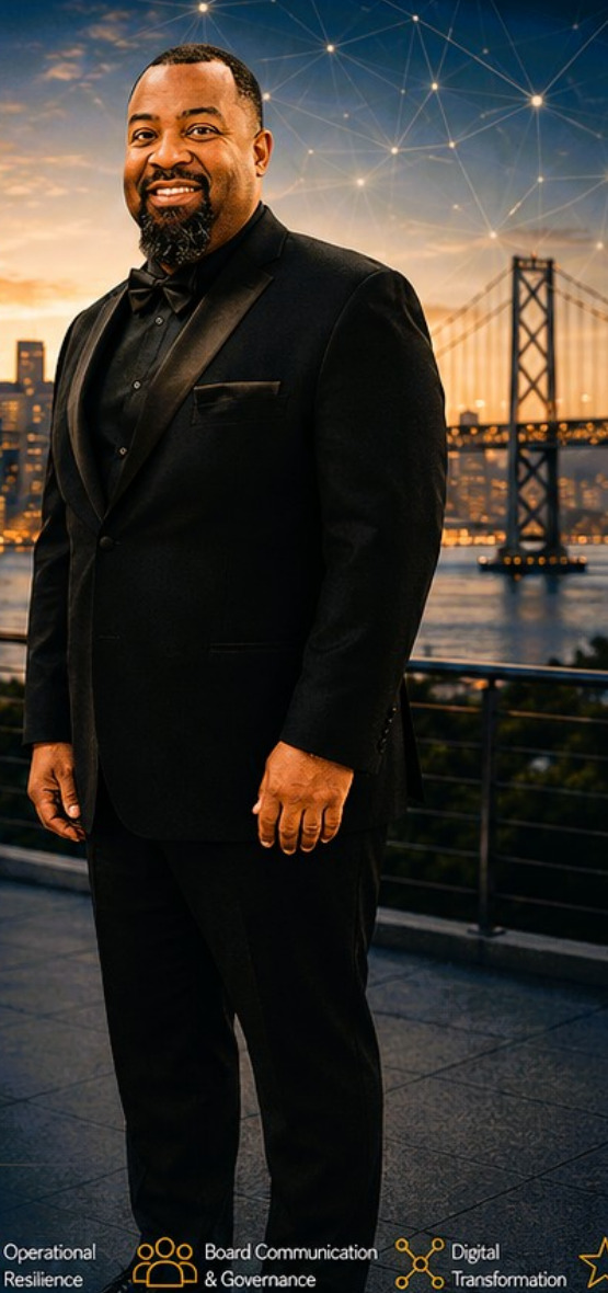 Kwame A. Fields wearing a black suit with the San Francisco skyline behind him